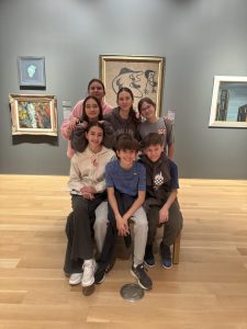 Students posing together in a museum gallery during the Meštrović visit.